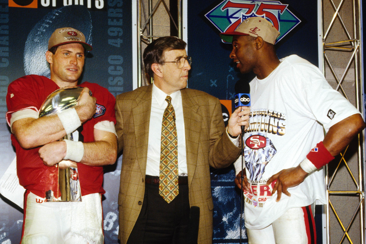 Steve Young and Jerry Rice talk to Brent Musberger after the 49ers’ victory in Super Bowl XXIX.